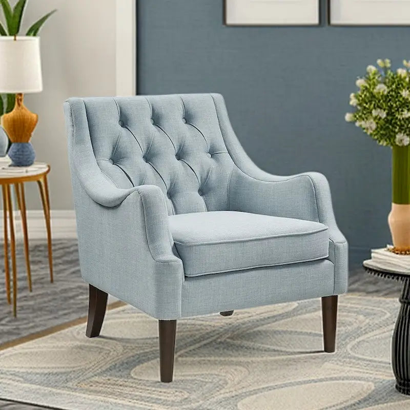 Sillón decorativo moderno con capitoné de botones, brazos redondos y patas de madera