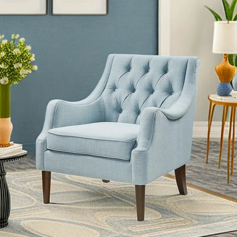 Sillón decorativo moderno con capitoné de botones, brazos redondos y patas de madera