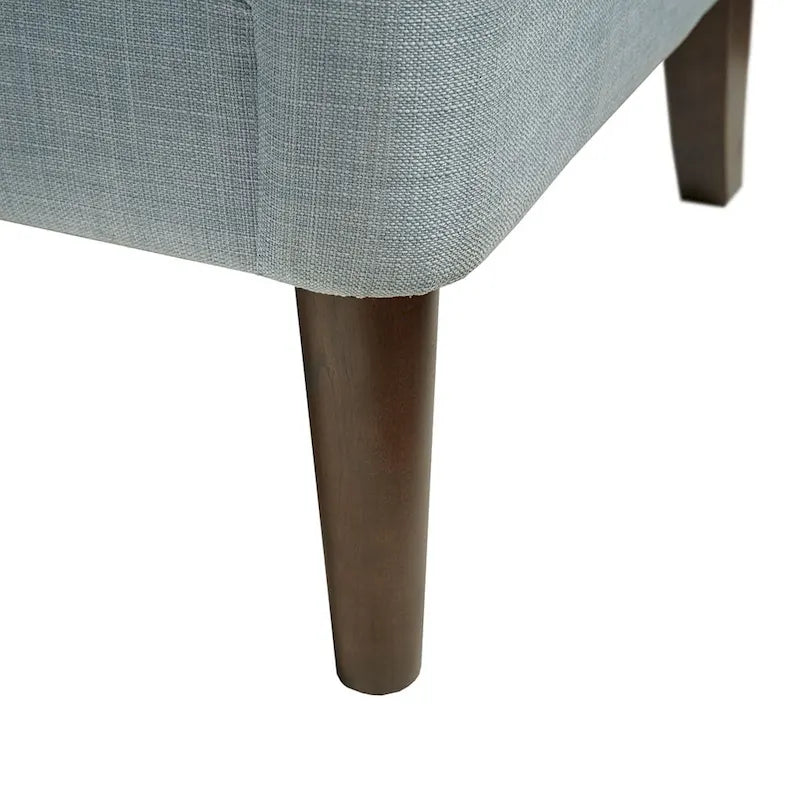 Sillón decorativo moderno con capitoné de botones, brazos redondos y patas de madera