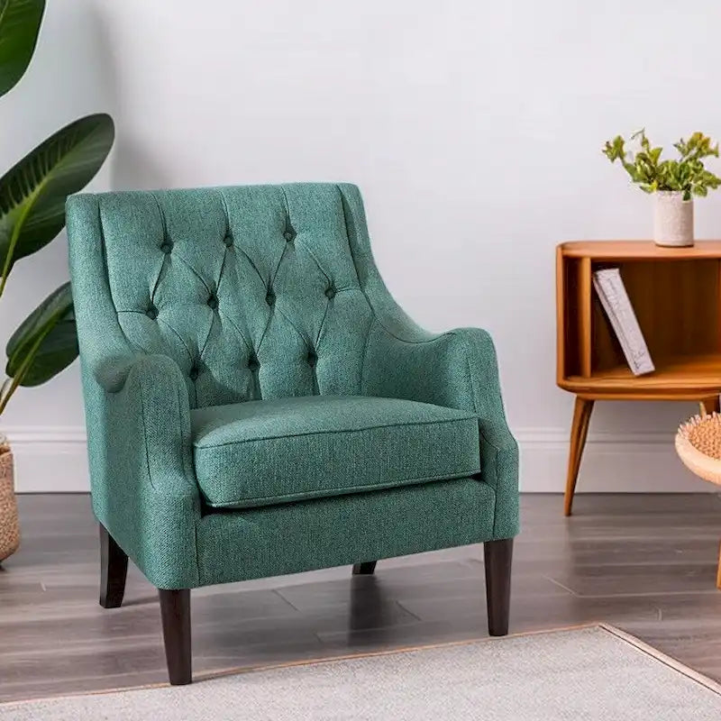 Sillón decorativo moderno con capitoné de botones, brazos redondos y patas de madera