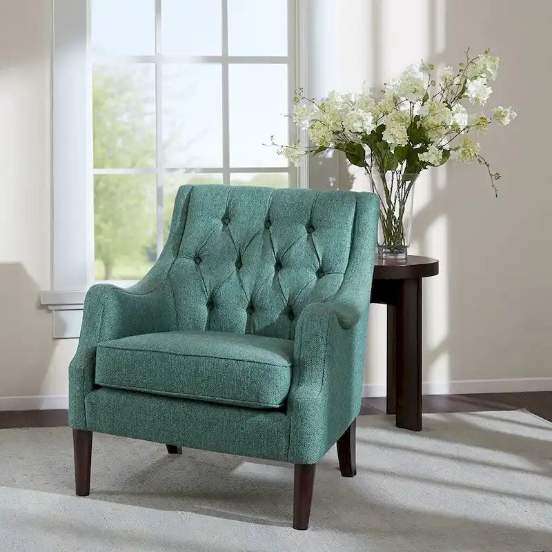 Sillón decorativo moderno con capitoné de botones, brazos redondos y patas de madera