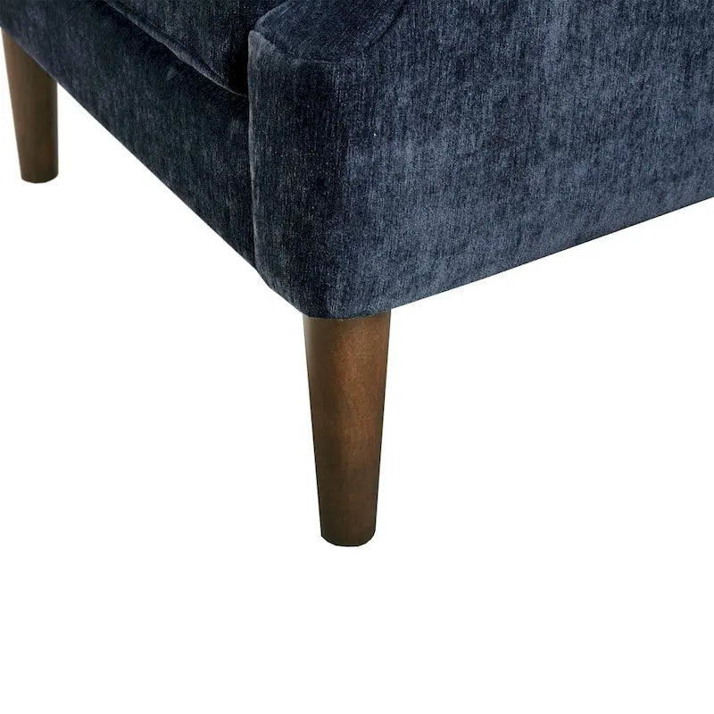Sillón decorativo moderno con capitoné de botones, brazos redondos y patas de madera